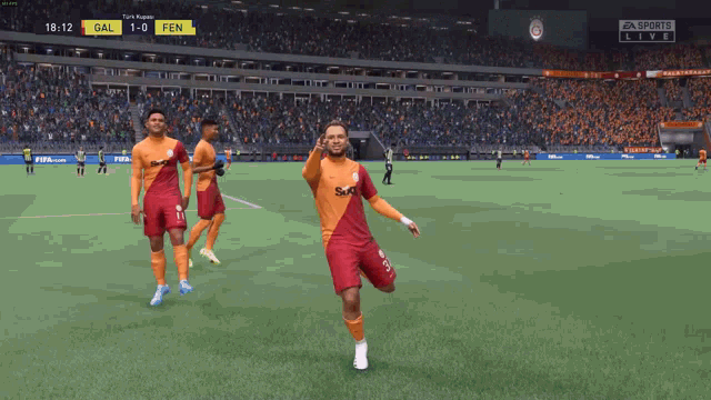 a soccer game is being played with a score of 1-0 for fen