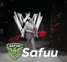 a man in a suit and tie is holding a gun in front of a w logo .