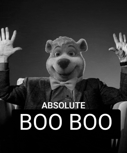 a black and white photo of a boo boo bear in a suit