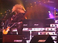 a man is playing a guitar in front of a marshall amplifier