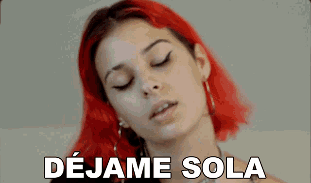 a close up of a woman with red hair and the words dejame sola above her