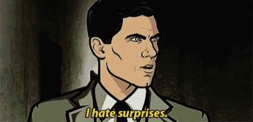 a man in a suit and tie is talking about surprises .