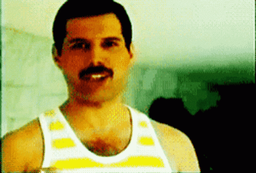 a man with a mustache is wearing a white and yellow tank top