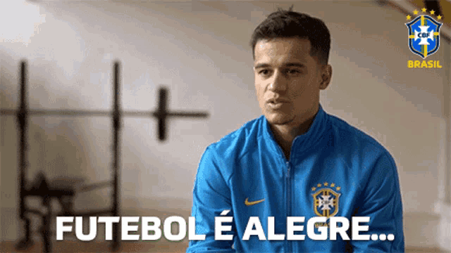 a man in a blue jacket says futebol e alegre in a foreign language