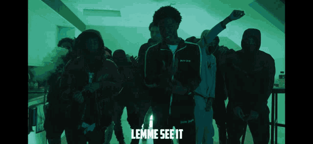 a group of people standing in a dark room with the words " lemme see it " on the bottom right