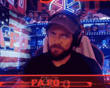 a man wearing headphones sits in front of a sign that says fapo