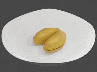 a gold fortune cookie with a card that says luki and cashi on it