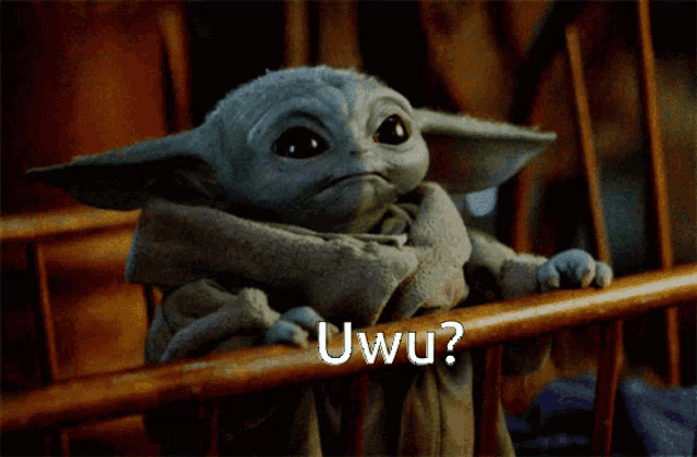 a baby yoda looking over a wooden railing with the words uwu written on the bottom