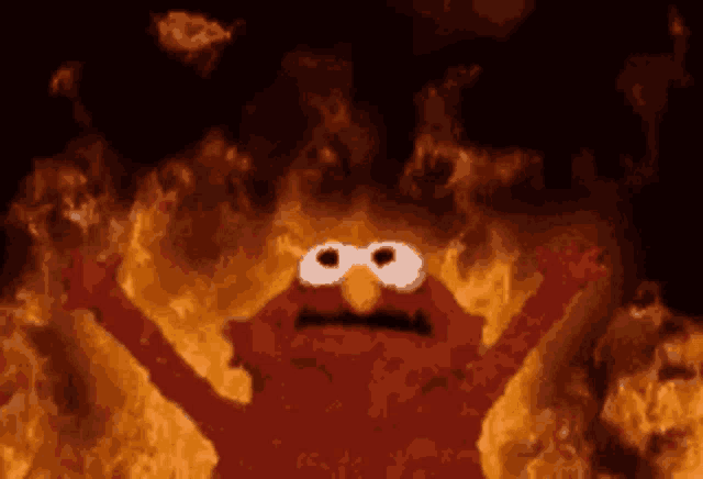 elmo from sesame street is surrounded by fire