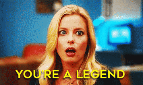 a woman with a surprised look on her face and the words " you 're a legend " above her