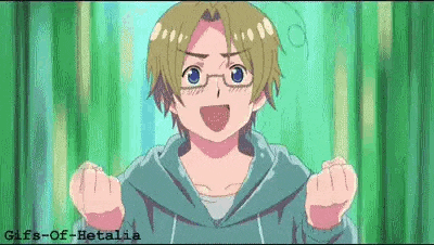 a boy with glasses and a blue hoodie is making a funny face .