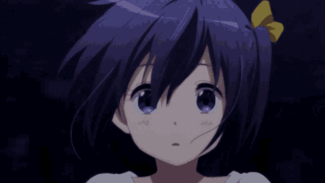 a girl with purple hair has a yellow bow on her hair