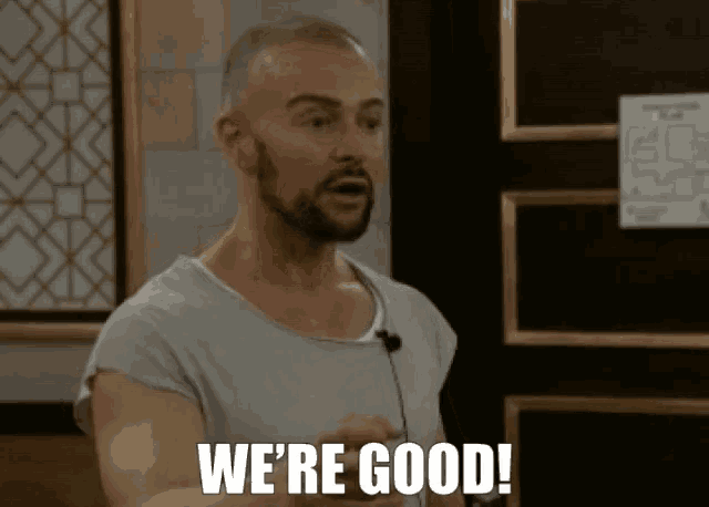 a man with a beard says we 're good in front of a door