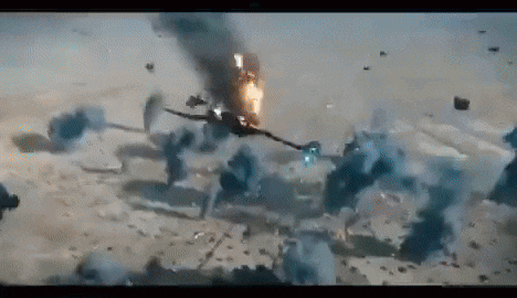 a fighter jet is flying through a cloud of smoke .