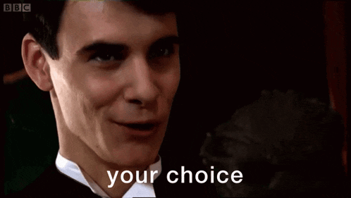 a man in a tuxedo says " your choice " in front of him