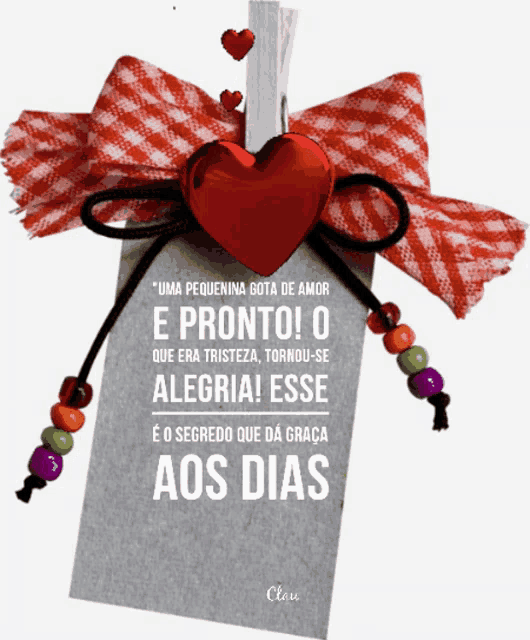 a card with a red heart and the words " uma pequenina gota de amor " written on it