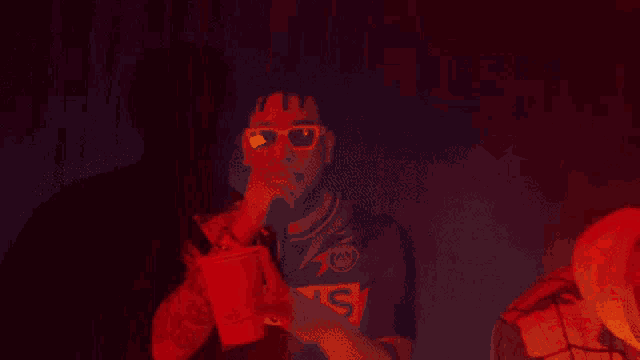 a man wearing sunglasses and a jersey that says ns