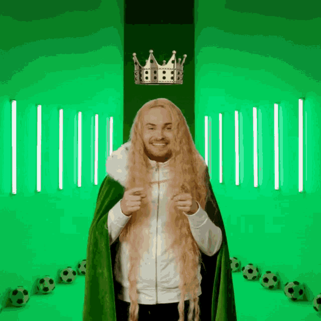 a man with long blonde hair wearing a crown