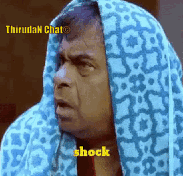 a man with a towel on his head says shock in yellow letters