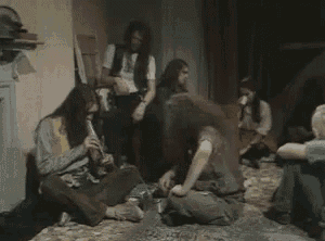 a group of people are sitting on the floor in a room