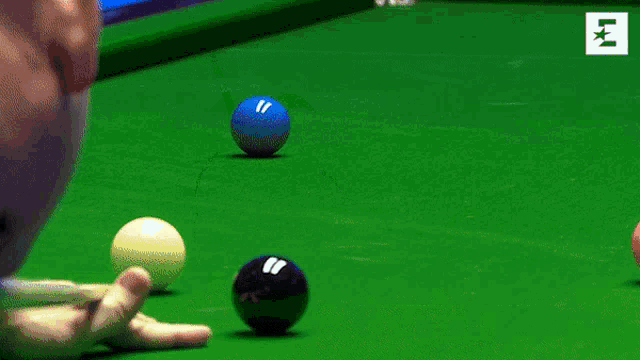 a pool table with a green cloth and a white pound sign on it