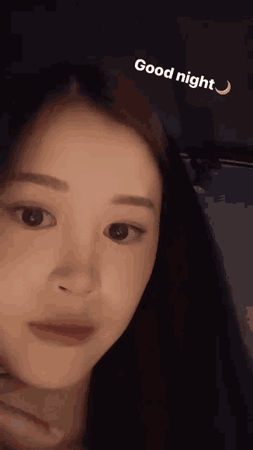 a close up of a woman 's face with the words good night written on it