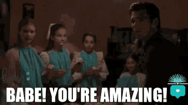 a woman is sitting in a dark room and says `` babe ! you 're amazing ! ''
