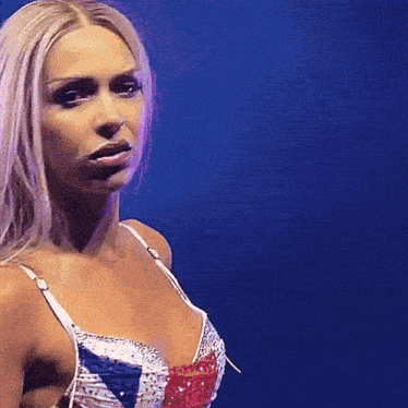 a woman is wearing a bra with a british flag design