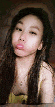 a woman making a face with her tongue out