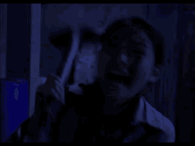 a woman screams in the dark while holding a mop