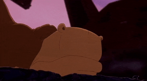 a cartoon frog is blowing a bubble with his mouth