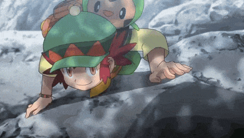 a boy in a green hat is crawling on a rock with a cartoon character on his back