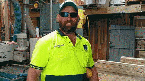 a man wearing sunglasses and a yellow shirt that says weiro on it