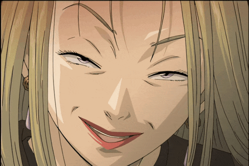 a close up of a woman 's face with blonde hair