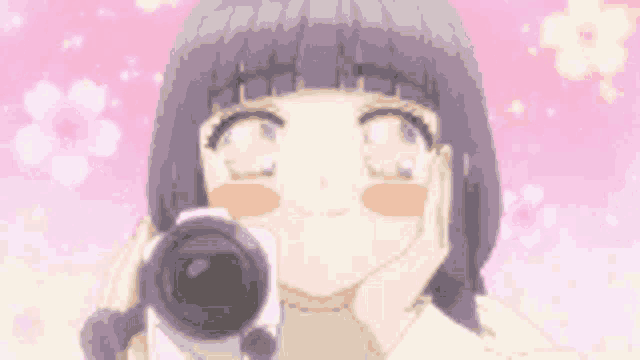 a girl is taking a picture with a camera in front of a pink background .