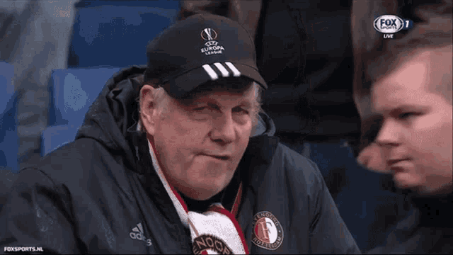 a man wearing a hat that says europe league on it