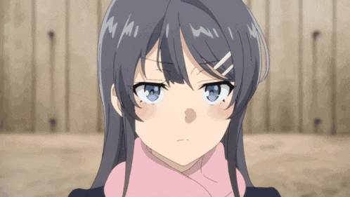 a girl with blue eyes and a pink scarf around her neck looks angry
