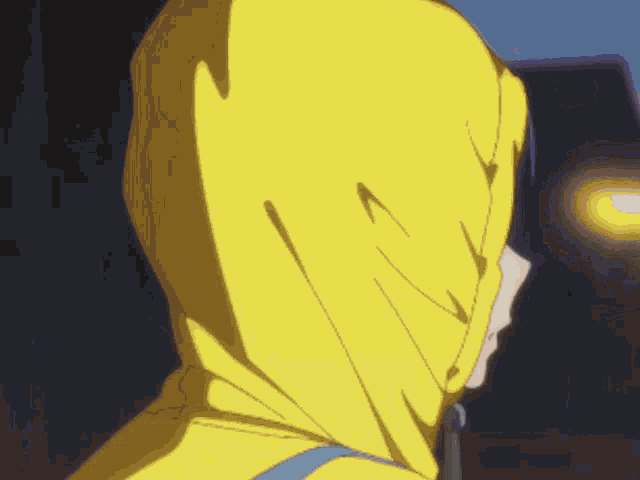 a girl wearing a yellow hooded jacket with a blue eye