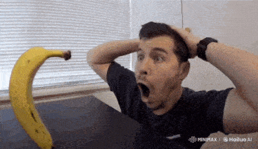 a man in a black shirt holds his hands to his head in front of a banana that says hailuo ai