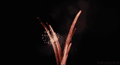 a fireworks display with the words " thehappyfolk " at the bottom of the image