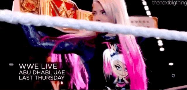 a woman in a wrestling ring with the words wwe live abu dhabi uae last thursday on the bottom