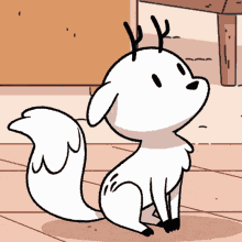 a cartoon of a white animal with antlers sitting on the floor