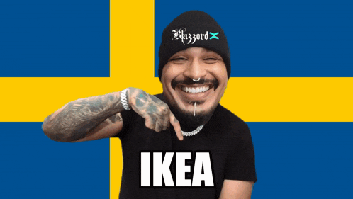 a man wearing a beanie and a black shirt with the word ikea on it