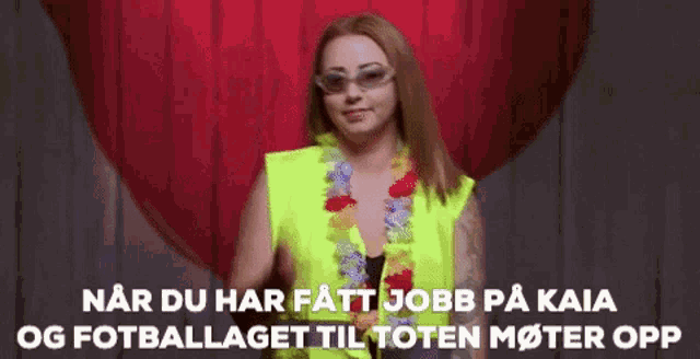 a woman wearing sunglasses and a yellow vest says " nar du har fatt jobb på kaia og fotballlaget til toten moter opp