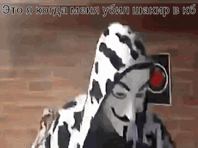 a man in a dalmatian costume is wearing a mask and a camera .