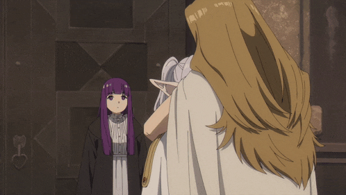 a woman with purple hair stands next to a man with blonde hair