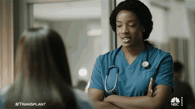 a nurse with a stethoscope around her neck is talking to a patient with the hashtag #transplant on the bottom