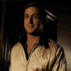 a man in a white jacket is standing in front of a window .