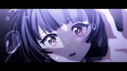 a close up of a girl 's face with bubbles coming out of it
