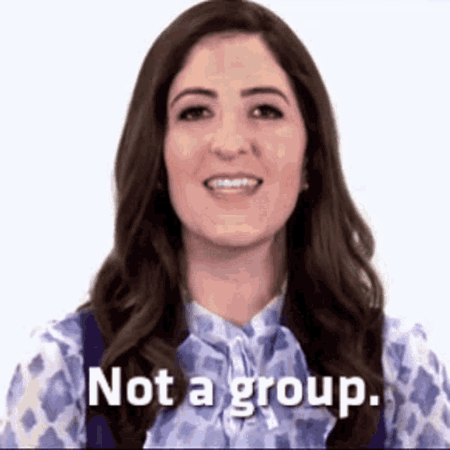 a woman is smiling and says `` not a group '' .